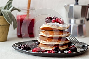 Pancakes with blackberries, raspberries and red currants. American cuisine
