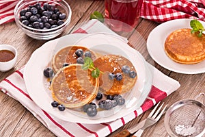 Pancakes with blueberries and chocolate cream.