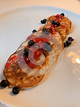 Pancakes for breakfast served with blueberries