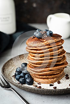 Pancakes with buckwheat and oat flour. Healthy vegan pancakes. Chocolate pancakes