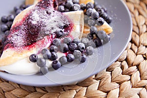 Pancakes with cheese, cream and blueberries