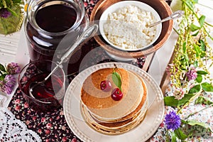 Pancakes with cherry flowers still life summer