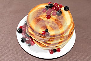 Pancakes with cranberries and black currants