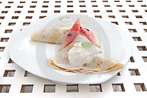 Pancakes cream and watermelon on white plate dessert