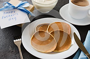 Pancakes and a cup of coffee for father. Father`s day concept