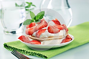 Pancakes with curd cheese and strawberries