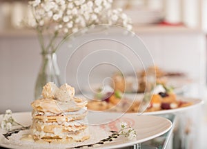 Pancakes with decorations and flowers in vase photo