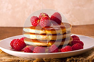 Pancakes with fresh and delicious raspberries.