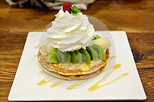 Pancakes with fresh giwi,banana and whipcream