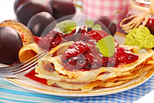 Pancakes with fresh plum`s confiture