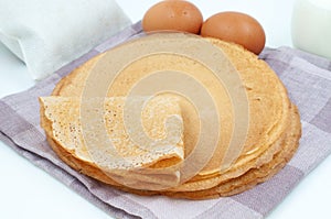 Pancakes and ingredients for cooking