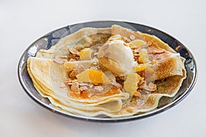 Pancakes jam scoop ice cream orange slices