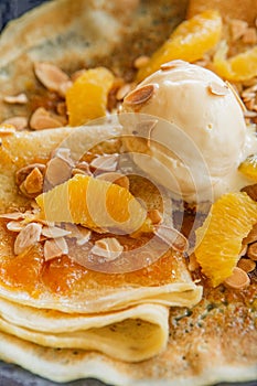 Pancakes jam scoop ice cream orange slices