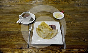 Pancakes with jam and tea