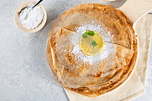 Pancakes with lemon and sugar. Traditional for Shrove Tuesday. Pancake day. Pancakes with lemon juice and powdered sugar