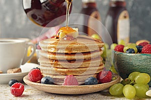 Pancakes with maple syrup and berries