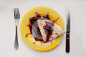 Pancakes with milk with currant jam