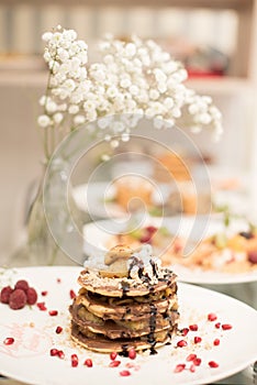 Pancakes on plate with decorations photo