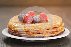 Pancakes with raspberry, blueberry and maple syrup