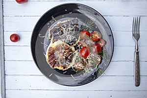 Pancakes with ricotta and parmesan cheese with cherry tomatoes