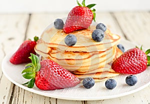 Pancakes served with berries