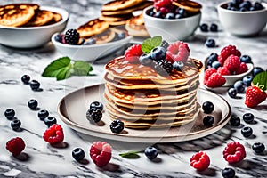pancakes served with berries on white plate