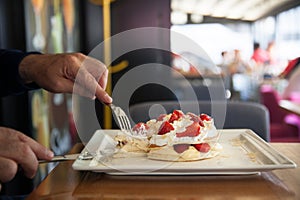 Pancakes with stawberries and cream ,the best breakfast for children and adults . Man eats dessert. Healthy eating for lunch . Clo