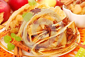 Pancakes with stewed apples ,raisins and cinnamon