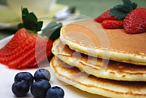 Pancakes with Strawberries and Blueberries photo