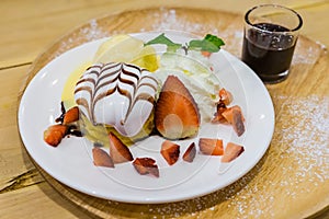 Pancakes with Strawberry and Vanilla Ice cream with chocolate to