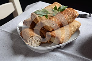 Pancakes stuffed with meat, herbs. Russian or Ukrainian cuisine