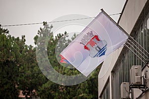Pancevo city flag with the coat of arms of the city. It is the official visual and symbol of Pancevo photo