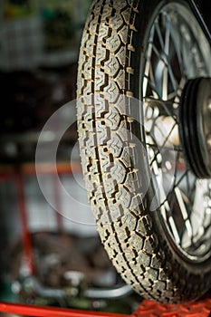 Pancevo, Serbia - September 27, 2019: Tire of Old timer motorcycle parked in collectors museum