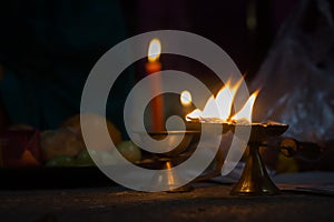 panch pradeep or five headed oil lamp burning with glowing flame. these are used in hindu puja rituals like durga , saraswati ,