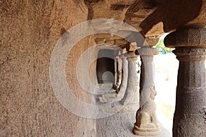 Stone pillars at Pancha Rathas at Mahabalipuram in Tamil Nadu, India photo