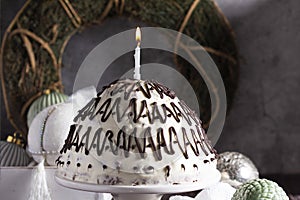 Pancho cake made of chocolate biscuit with sour cream and pineapple in New Year's or Christmas decoration. Rustic