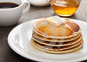 Panckes with butter and syrup with coffee in the