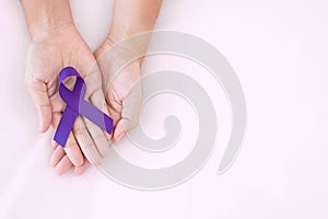 Pancreatic Cancer, world Alzheimer, epilepsy, lupus and domestic violence day Awareness month, Woman holding purple Ribbon for photo