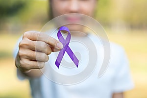 Pancreatic Cancer, world Alzheimer, epilepsy, lupus and domestic violence day Awareness month, Woman holding purple Ribbon for