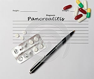 Pancreatitis diagnosis written on a white piece of paper