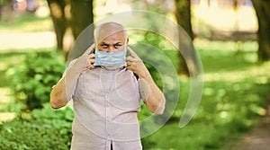 Pandemic concept. Limit risk infection spreading. Senior man face mask. Older people highest risk covid-19. Easing of