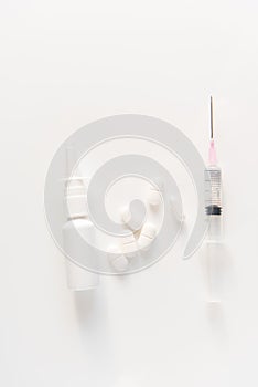 pills, drops and syringe on white background. medicina, quarantine. photo