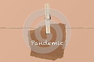 Pandemic single word on cardboard latched. in coronavirus
