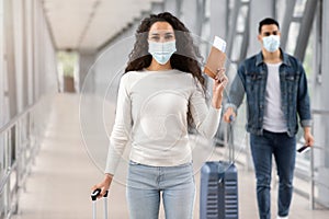 Pandemic Travels. Middle-Eastern Woman In Medical Face Mask Posing At Airport Terminal