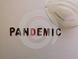 Pandemic wooden inscription on white background