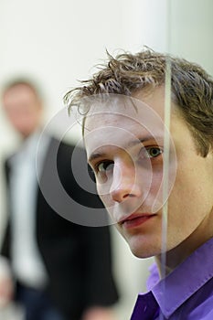 Pane,man's face portrait, another man in background