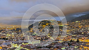 Panecillo hill Virgen of Quito statue and old colonial center of Quito at blue hour