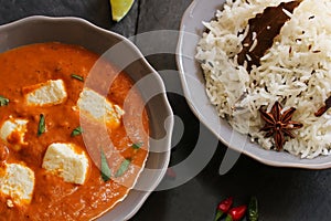 Paneer Butter masala and cooked rice Indian Curry Dinner