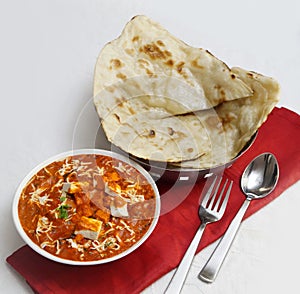 Paneer butter masala curry with Butter naan Indian Breads