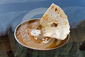 Paneer and cheese curry , indian food in metal bowl